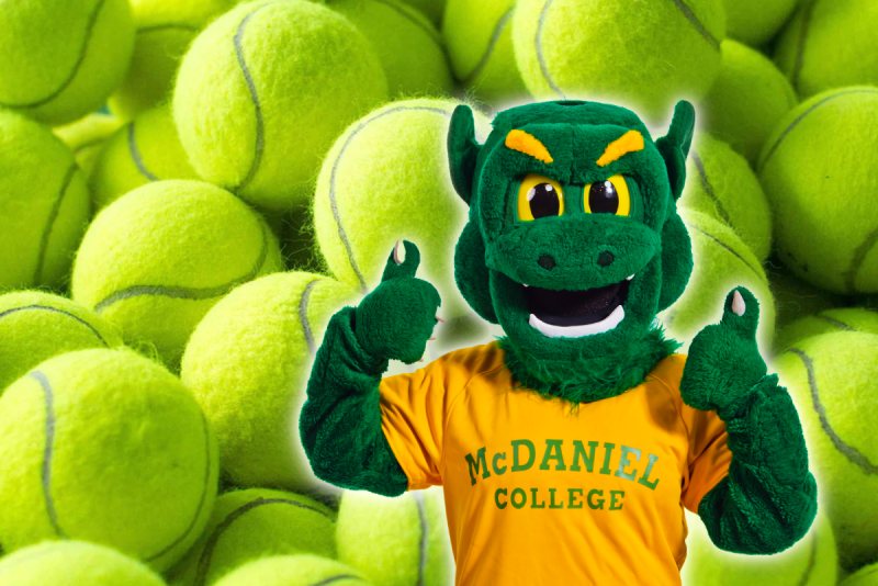Green Terror mascot w tennis balls